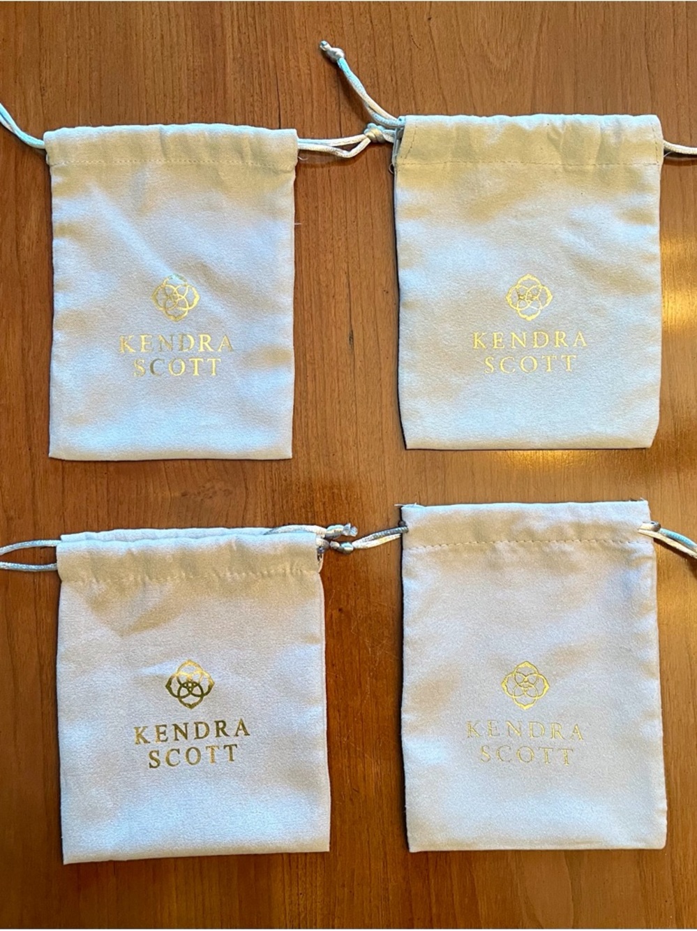 Kendra Scott Light Grey Velvet-Like Drawstring Pouches with Gold Logo (Set of 4)